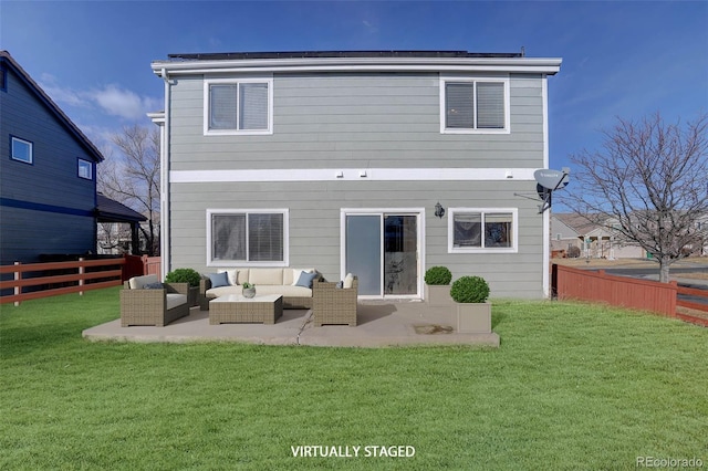 rear view of house with an outdoor hangout area, solar panels, a yard, and a patio