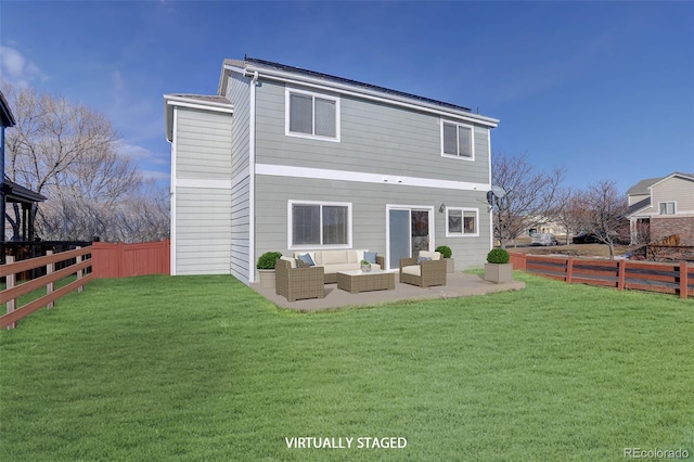 back of property with outdoor lounge area, a yard, and a patio