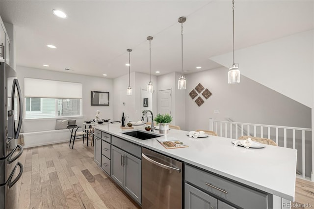 2052 Alcott Way, Broomfield, CO 80023 - kitchen featuring a sink, stainless steel appliances, gray cabinetry, light wood finished floors, and recessed lighting
