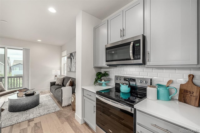2052 Alcott Way, Broomfield, CO 80023 - kitchen with stainless steel appliances, healthy amount of natural light, light countertops, and recessed lighting