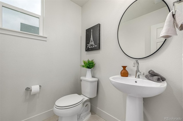 2052 Alcott Way, Broomfield, CO 80023 - half bathroom featuring baseboards, toilet, and tile patterned flooring