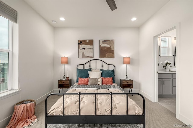 2052 Alcott Way, Broomfield, CO 80023 - carpeted bedroom featuring multiple windows, ensuite bath, recessed lighting, and baseboards