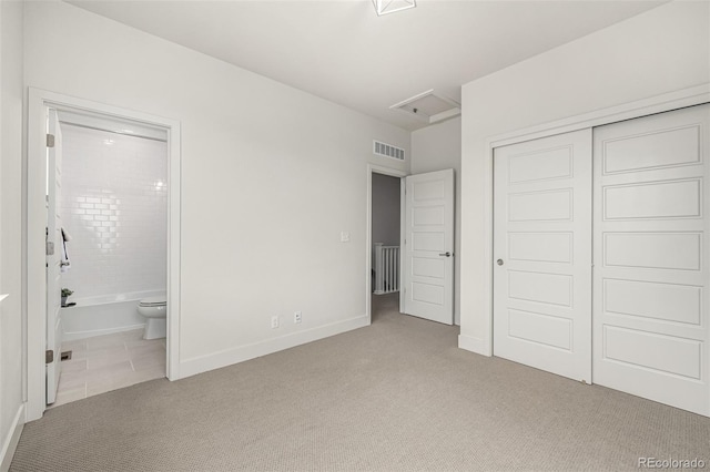 2052 Alcott Way, Broomfield, CO 80023 - unfurnished bedroom featuring carpet flooring, attic access, a closet, ensuite bath, and baseboards