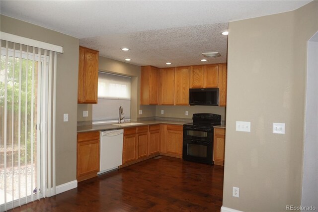 20630 E Hamilton Ave, Aurora, CO 80013 - kitchen featuring black appliances, a sink, dark wood-type flooring, light countertops, and recessed lighting