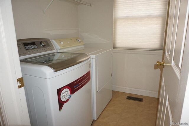 20630 E Hamilton Ave, Aurora, CO 80013 - laundry area with separate washer and dryer and light tile patterned flooring