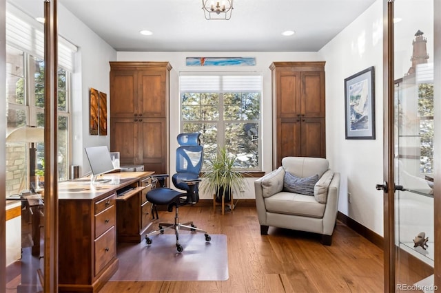 office space with light wood-type flooring