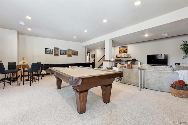 recreation room with pool table and light colored carpet