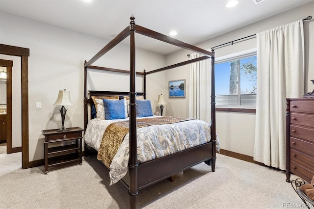 bedroom featuring light carpet