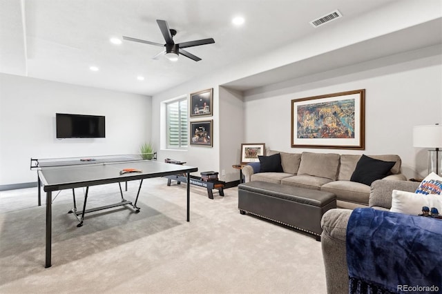 playroom featuring ceiling fan and light carpet