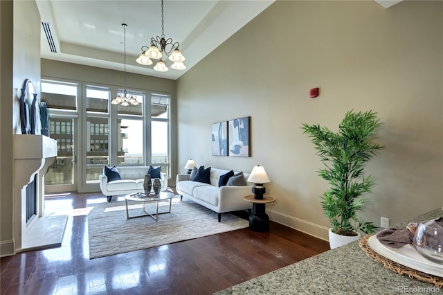 5455 Landmark Pl Unit 1403, Greenwood Village, CO 80111 - living room with wood finished floors, a chandelier, baseboards, and a high ceiling