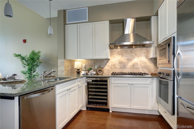 5455 Landmark Pl Unit 1403, Greenwood Village, CO 80111 - kitchen with wine cooler, stainless steel appliances, wall chimney exhaust hood, a sink, and white cabinets