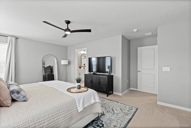 bedroom with light carpet, ceiling fan, and baseboards