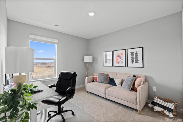 carpeted home office with baseboards and visible vents