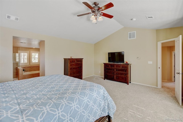 carpeted bedroom featuring lofted ceiling, a ceiling fan, and visible vents