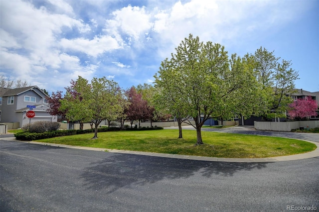 view of front of home with a front lawn and a residential view