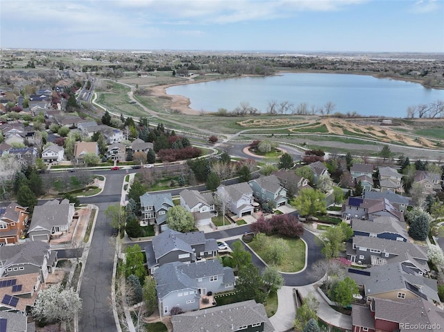 aerial view featuring a water view and a residential view