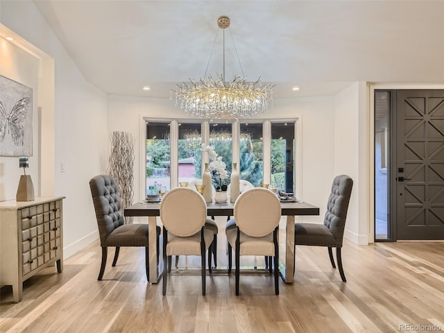 dining area with a chandelier, baseboards, light wood finished floors, and recessed lighting