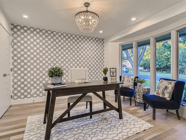 office featuring a chandelier, recessed lighting, an accent wall, light wood finished floors, and baseboards