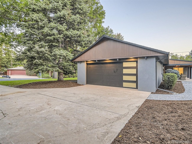 garage with concrete driveway