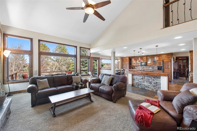 34 Amaranth Dr, Littleton, CO 80127 - living room with dark carpet, a ceiling fan, high vaulted ceiling, and recessed lighting