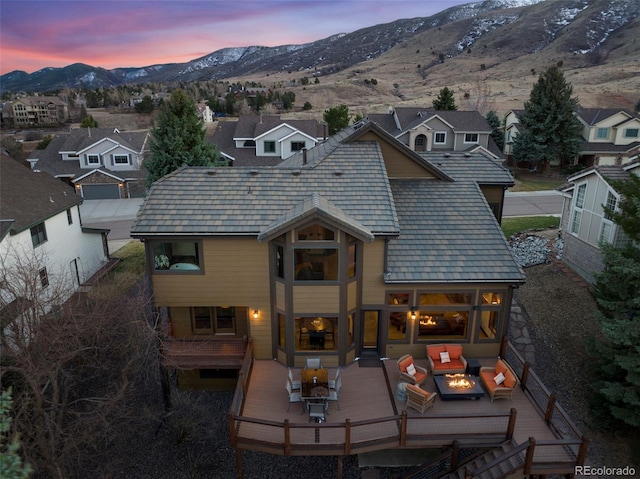 34 Amaranth Dr, Littleton, CO 80127 - back of house featuring an outdoor living space, a deck with mountain view, and a residential view