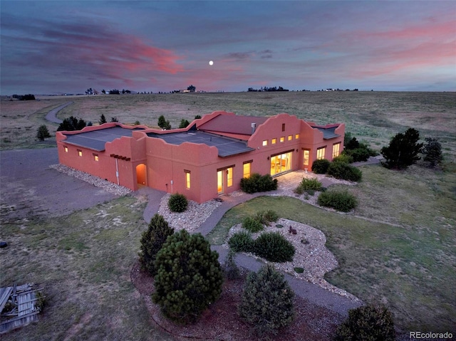 5549 Yulle Rd, Bennett, CO 80102 - view of front of home featuring stucco siding and a view of rural / pastoral area