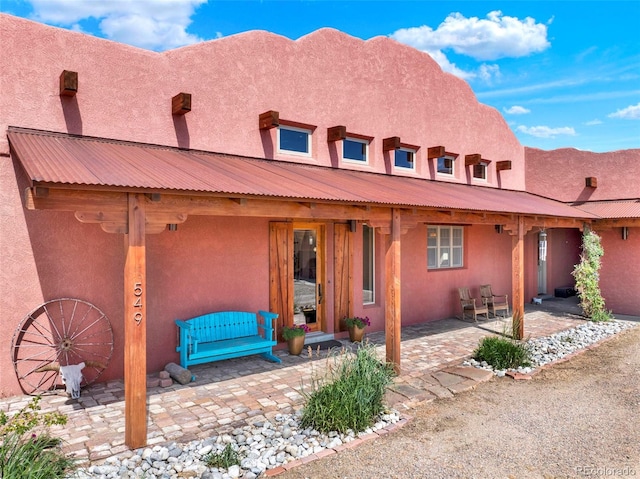 5549 Yulle Rd, Bennett, CO 80102 - view of front facade with a patio and stucco siding