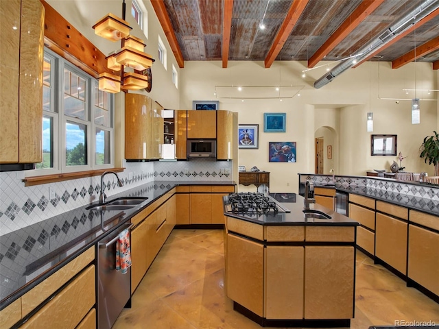 5549 Yulle Rd, Bennett, CO 80102 - kitchen with arched walkways, backsplash, a center island, stainless steel appliances, and decorative light fixtures
