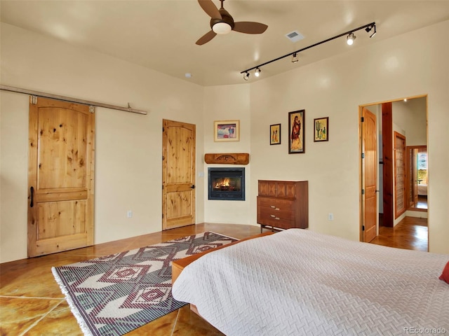 5549 Yulle Rd, Bennett, CO 80102 - bedroom with a glass covered fireplace and track lighting