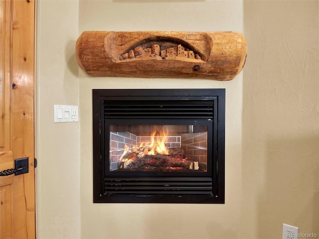 5549 Yulle Rd, Bennett, CO 80102 - detailed view of a warm lit fireplace