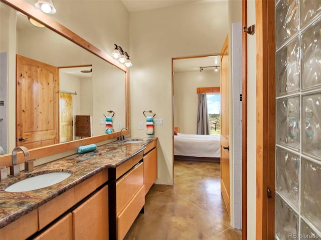 5549 Yulle Rd, Bennett, CO 80102 - full bathroom with double vanity and ensuite bathroom