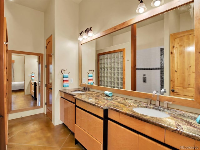 5549 Yulle Rd, Bennett, CO 80102 - bathroom with double vanity and tile patterned floors