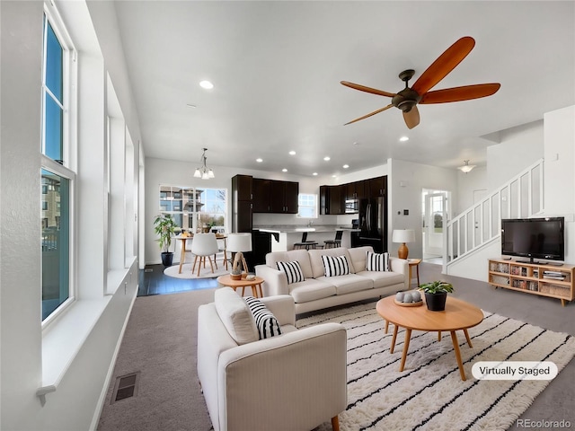 1826 Sunshine Ave, Longmont, CO 80504 - living area featuring recessed lighting, ceiling fan, stairway, a chandelier, and baseboards