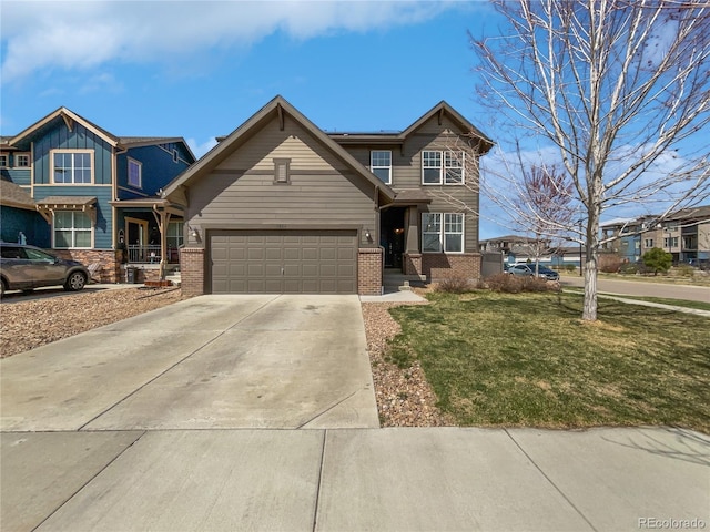 1826 Sunshine Ave, Longmont, CO 80504 - view of front of property featuring brick siding, driveway, and a front yard