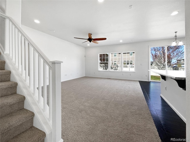 1826 Sunshine Ave, Longmont, CO 80504 - unfurnished living room featuring recessed lighting, a ceiling fan, stairway, baseboards, and dark wood-type flooring