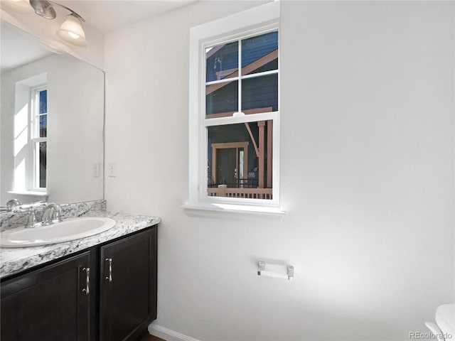 1826 Sunshine Ave, Longmont, CO 80504 - bathroom with vanity and baseboards
