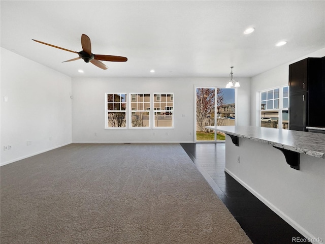 1826 Sunshine Ave, Longmont, CO 80504 - unfurnished living room with recessed lighting, ceiling fan, baseboards, and a chandelier