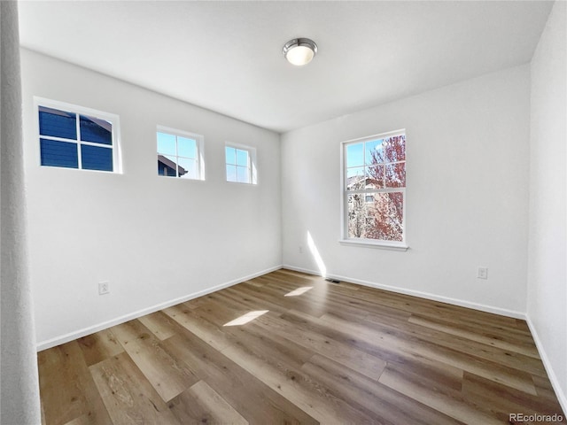 1826 Sunshine Ave, Longmont, CO 80504 - unfurnished room with wood finished floors and baseboards