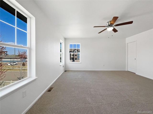 1826 Sunshine Ave, Longmont, CO 80504 - unfurnished room with healthy amount of natural light, ceiling fan, carpet flooring, and baseboards