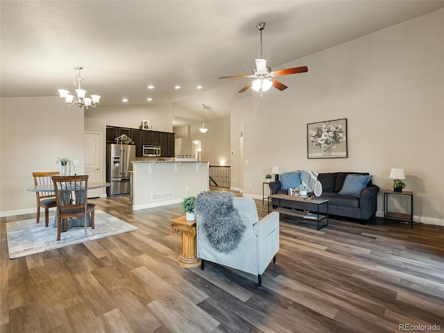 living area featuring dark wood-style floors, visible vents, baseboards, and ceiling fan with notable chandelier