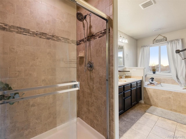 full bathroom featuring a stall shower, visible vents, tile patterned floors, vanity, and a bath