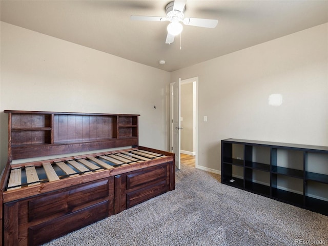 carpeted bedroom featuring baseboards