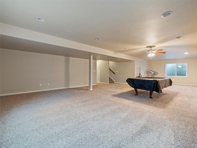 game room with pool table, light carpet, a textured ceiling, and baseboards