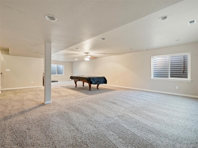 recreation room with a textured ceiling, billiards, visible vents, baseboards, and carpet