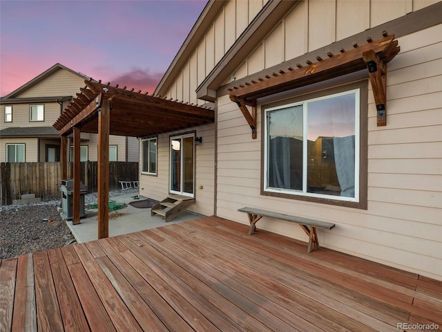 deck featuring a patio, fence, a pergola, and area for grilling