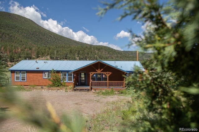 exterior space featuring a mountain view and a porch