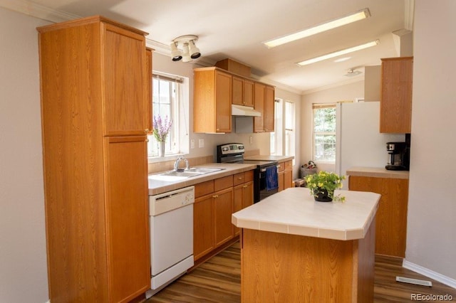 kitchen featuring wood-type flooring, white appliances, sink, a kitchen island, and lofted ceiling