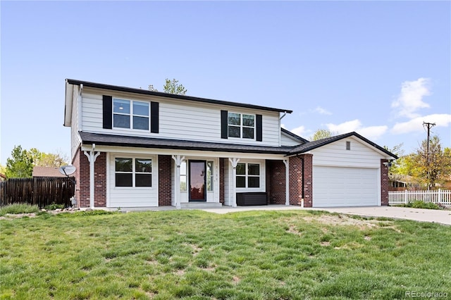 5199 Arbutus St, Arvada, CO 80002 - traditional-style house featuring an attached garage, concrete driveway, brick siding, and covered porch