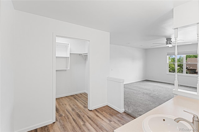 5199 Arbutus St, Arvada, CO 80002 - bathroom with ceiling fan, wood finished floors, baseboards, and vanity