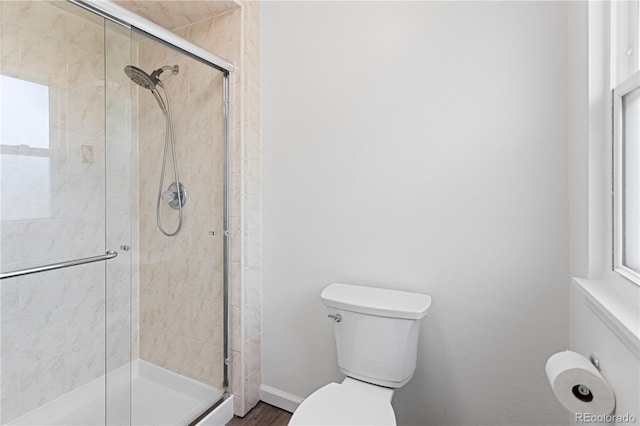 5199 Arbutus St, Arvada, CO 80002 - bathroom featuring a stall shower, toilet, and baseboards